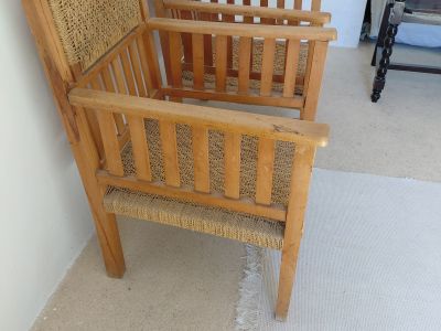 2 antique wooden armchairs with woven seats