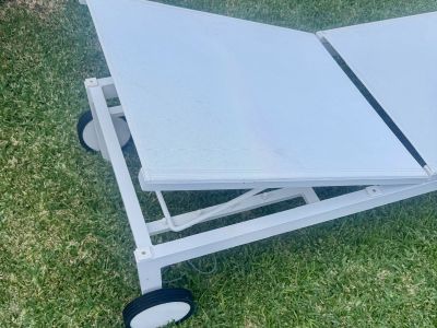 4 white aluminum sun loungers with wheels