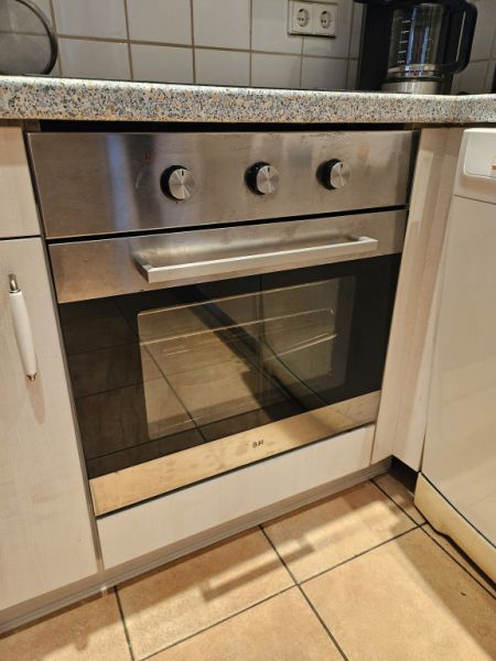 Oven with induction cooktop