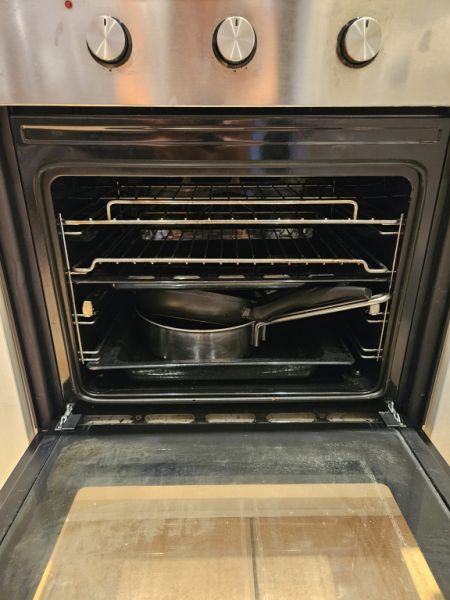 Oven with induction cooktop