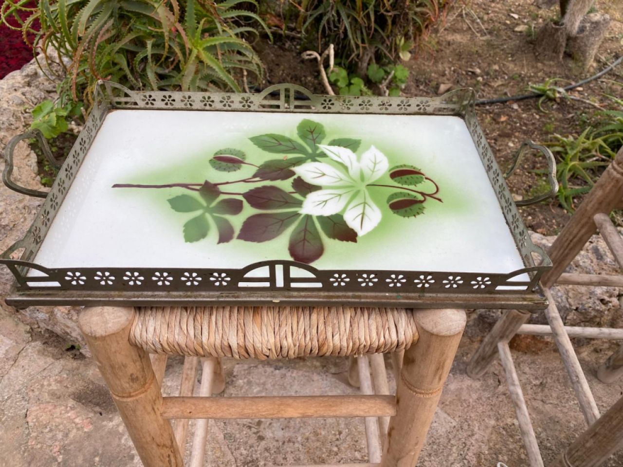 Decorative antique metal tray with plant motif, green