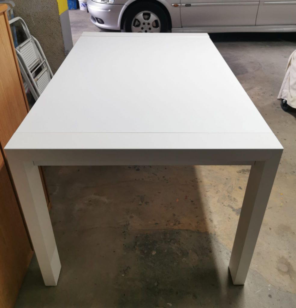 White solid wood extendable dining table