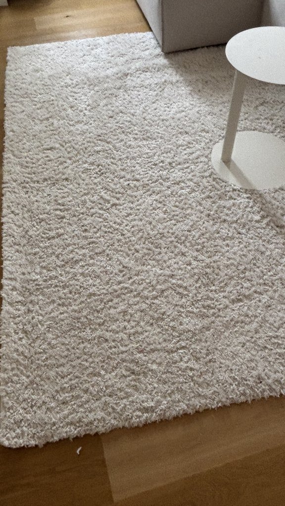 Fluffy IKEA high-pile rug in cream white