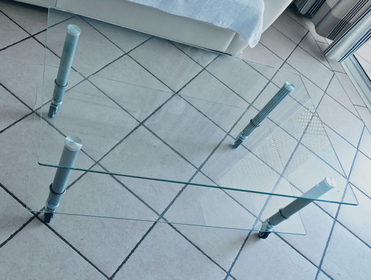 Glass coffee table with wheels
