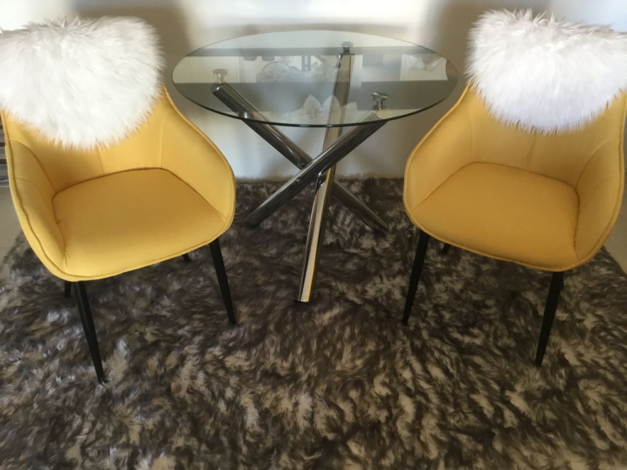 Glass table and two armchairs