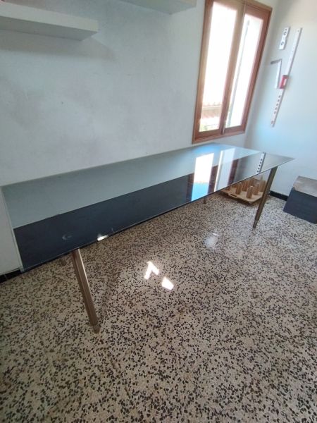 Glass table with stainless steel base