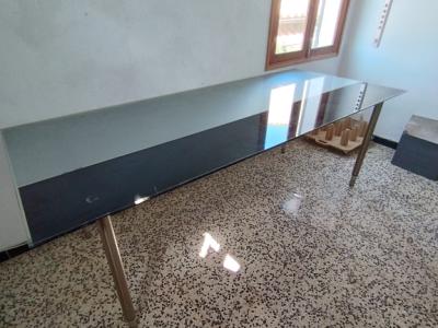 Glass table with stainless steel base