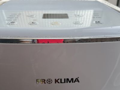 Mobile air conditioner with exhaust hose