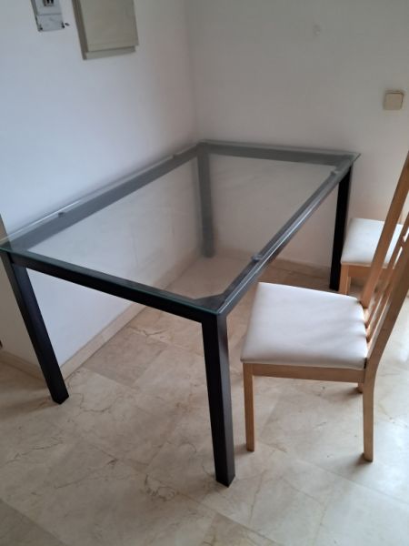 Metal table with glass top