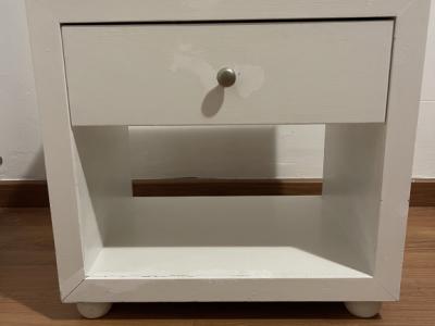 White wooden bedside table with drawer