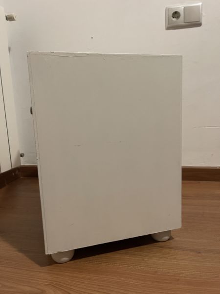 White wooden bedside table with drawer