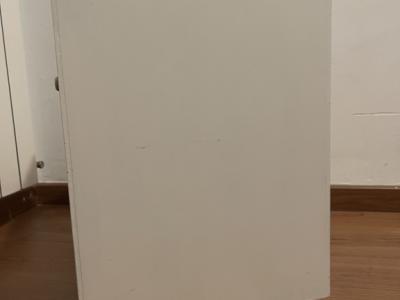 White wooden bedside table with drawer