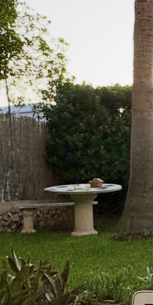 Round stone table with bench
