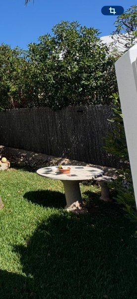 Round stone table with bench