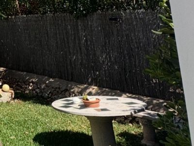 Round stone table with bench