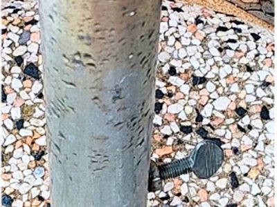 Round umbrella stand made of concrete and stainless steel tube with new sun umbrella