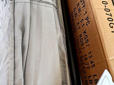 Round umbrella stand made of concrete and stainless steel tube with new sun umbrella