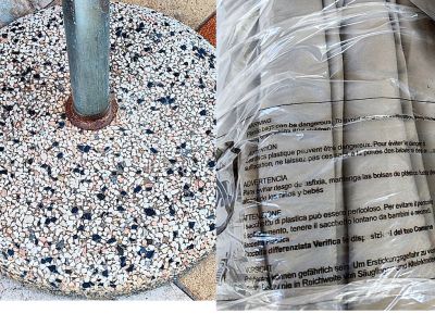 Round umbrella stand made of concrete and stainless steel tube with new sun umbrella