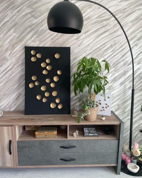 Pieza única en negro/dorado