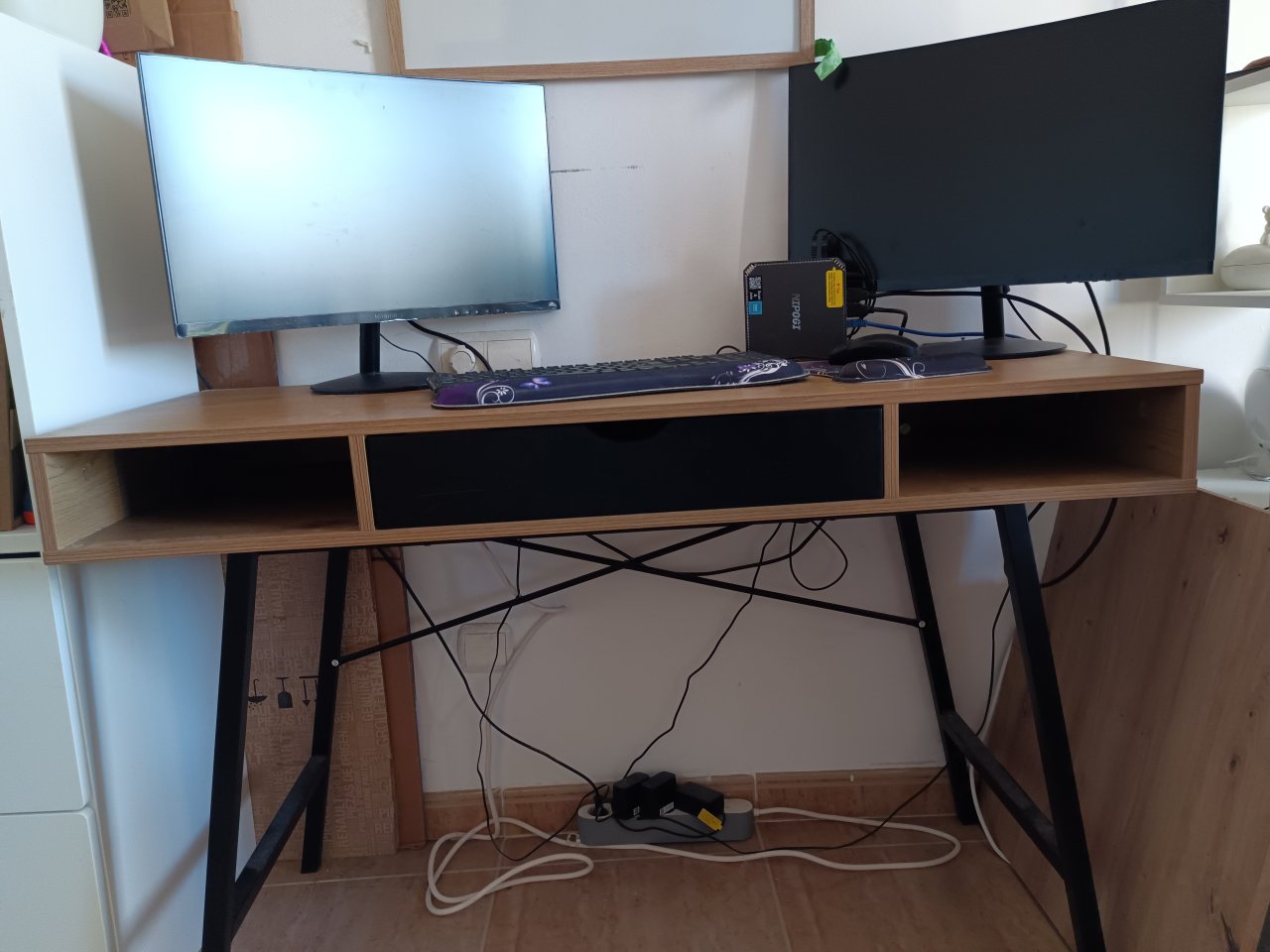 Two monitors, keyboard and documents